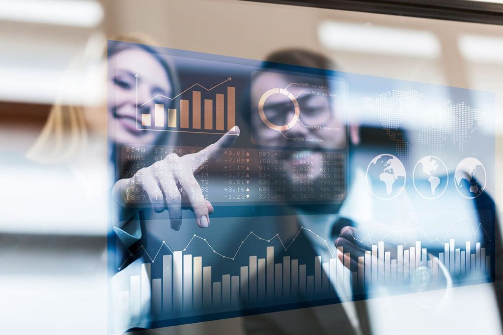 Business analytics interactive touchscreen with data graphs.