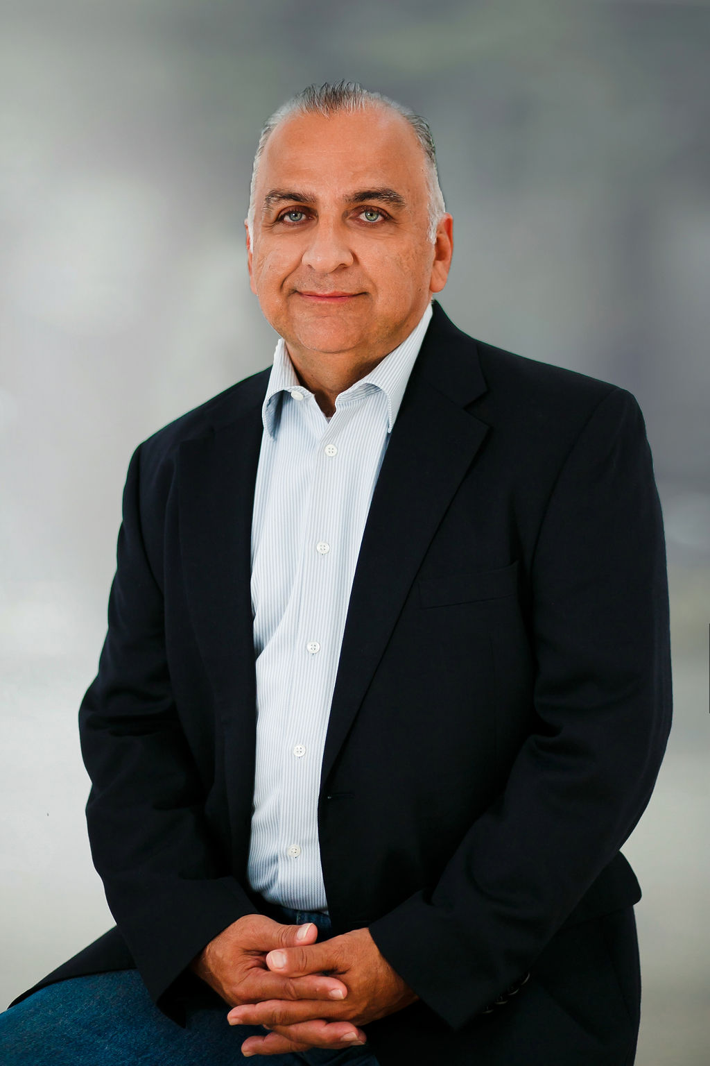 Professional man in suit smiling confidently.