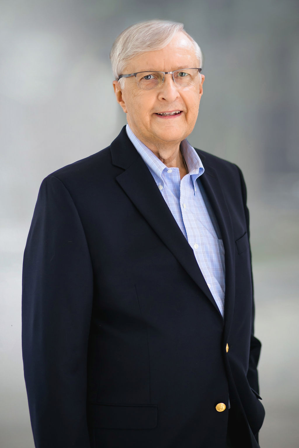 Senior man in business attire smiling