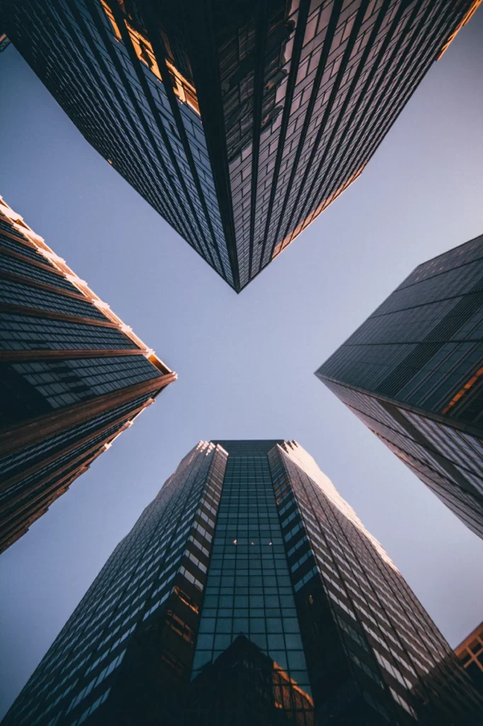 Upward view of skyscrapers against sky.