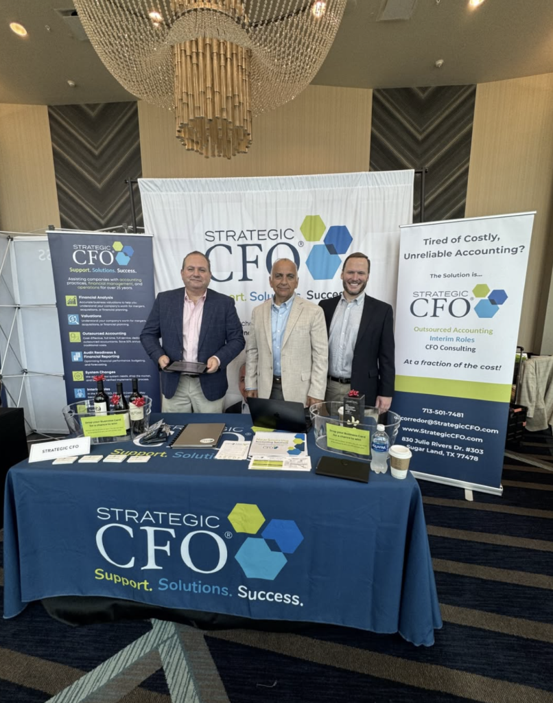 Strategic CFO Team at Business Conference Booth
