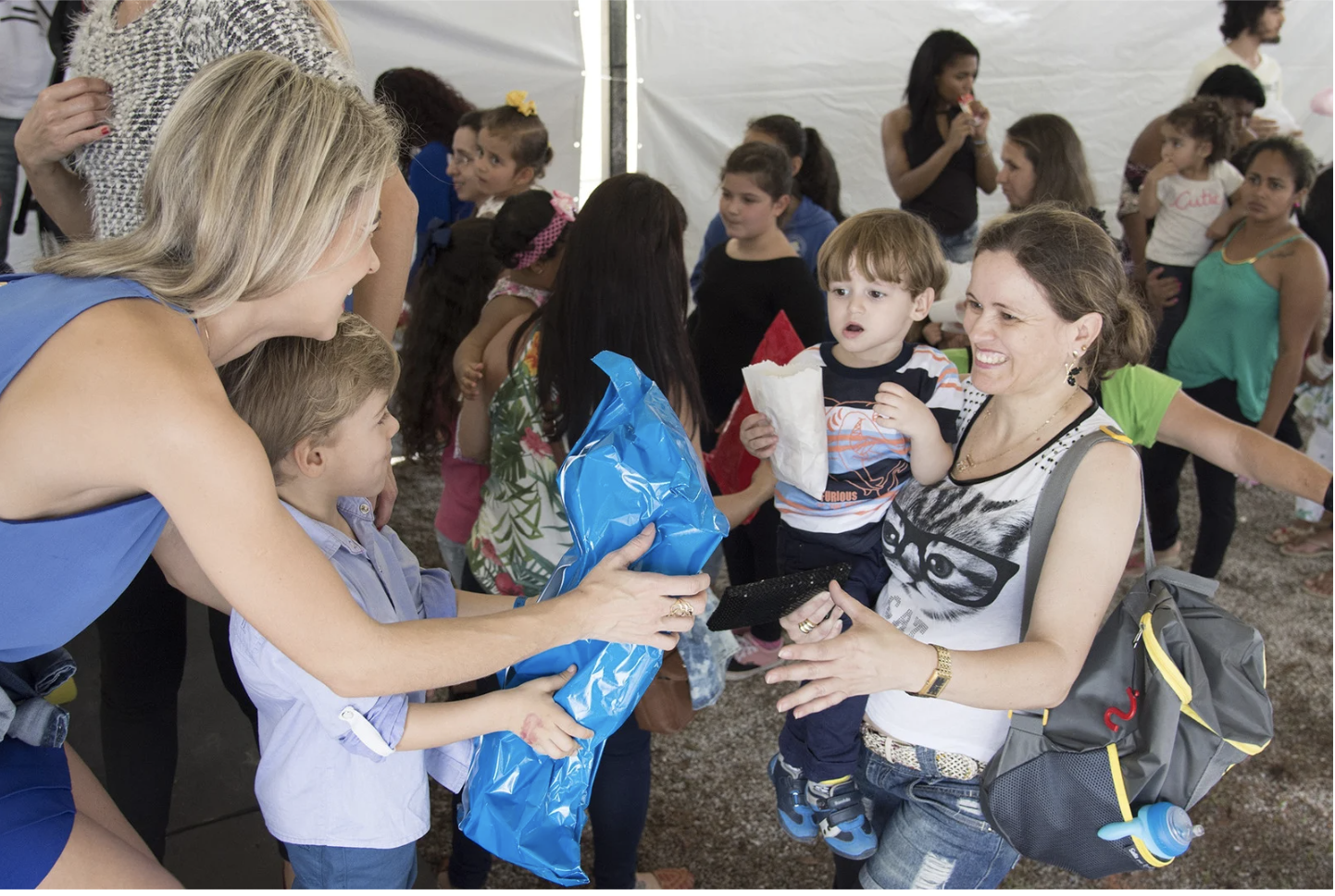 Community Members Exchanging Gifts at Local Event