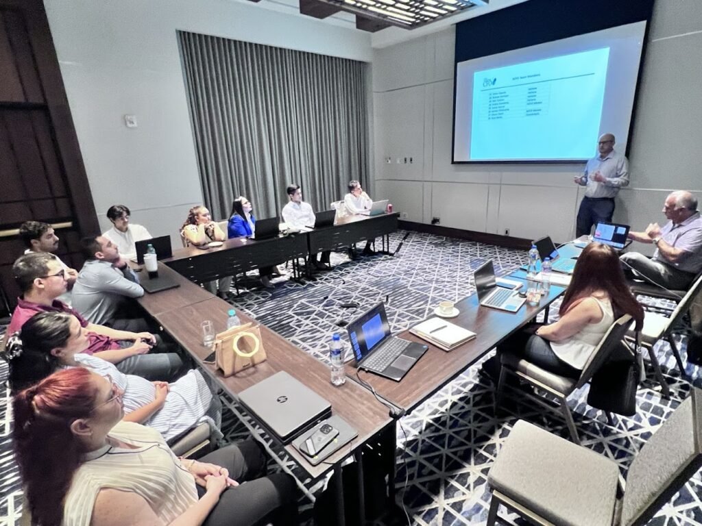 Business meeting with presentation and laptops.