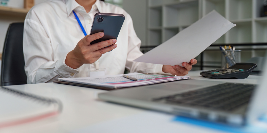 Business owner reviewing financial records during a QuickBooks clean up